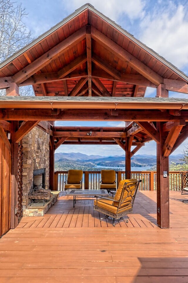 444 Wild Turkey, Tiger, GA 30576 - deck featuring an outdoor stone fireplace, a gazebo, and a water and mountain view