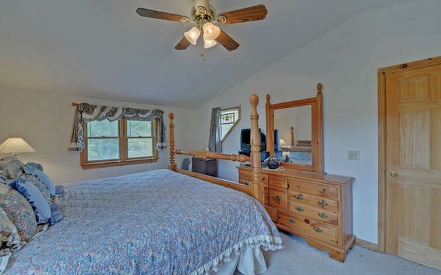 bedroom with ceiling fan, carpet flooring, and lofted ceiling