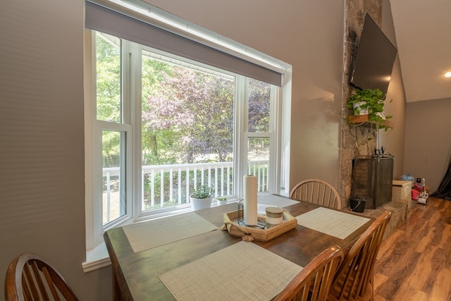 dining space with wood finished floors