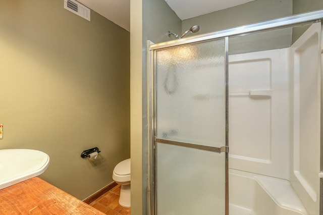 full bathroom featuring tile patterned floors, visible vents, toilet, and a shower stall