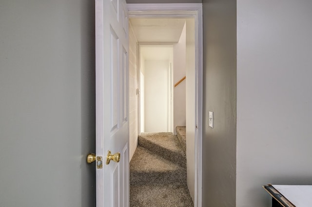 corridor with stairway and carpet flooring