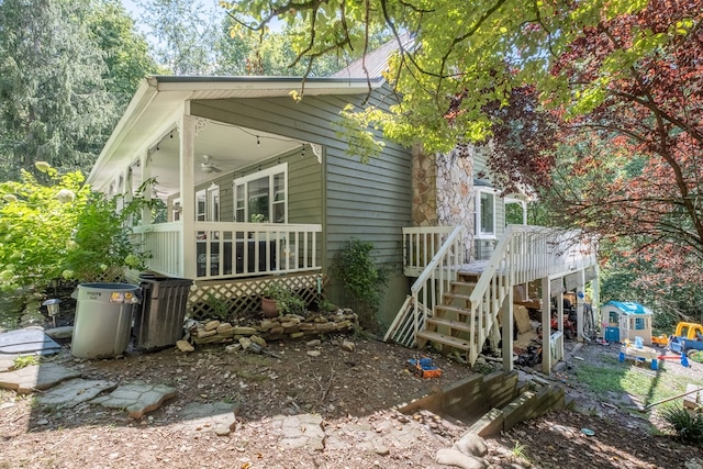 exterior space with a ceiling fan and a wooden deck