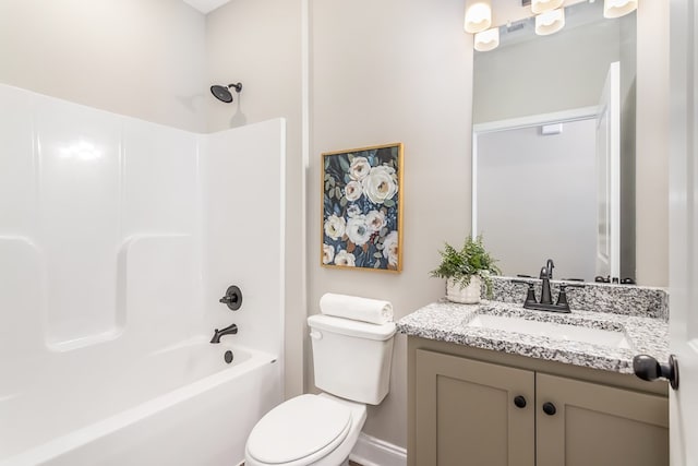 bathroom with shower / tub combination, toilet, and vanity