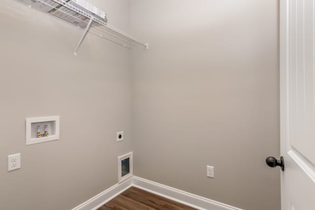 laundry room featuring dark wood-type flooring, baseboards, laundry area, hookup for a washing machine, and electric dryer hookup