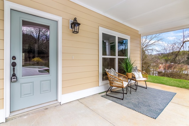 entrance to property featuring a porch