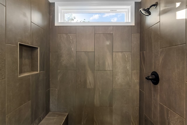 full bath featuring a tile shower