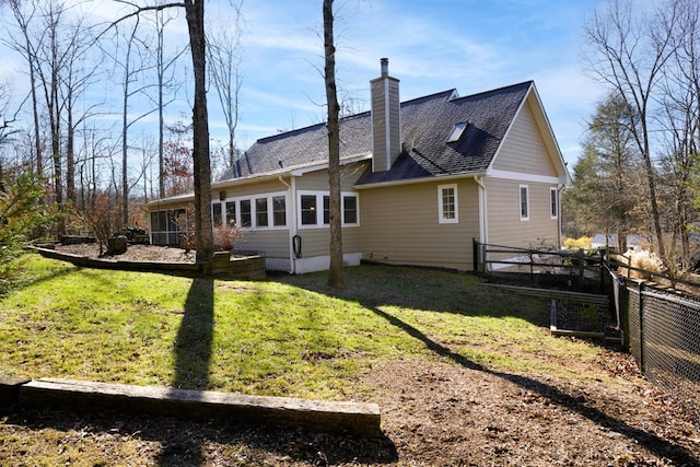 back of house featuring a yard