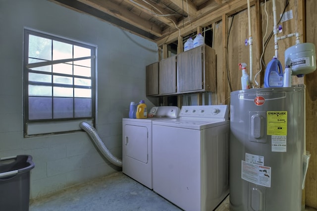 washroom featuring cabinets, water heater, and independent washer and dryer