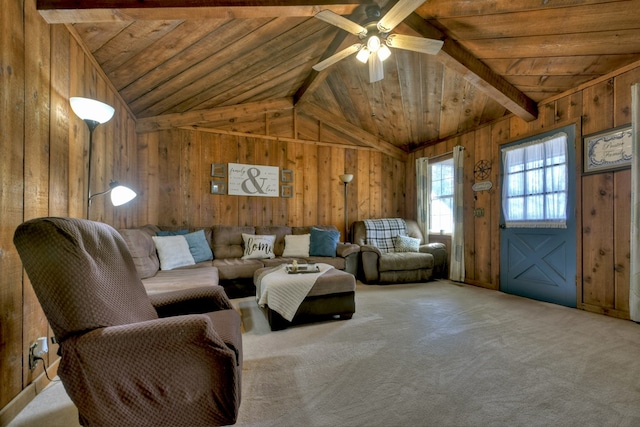 living room with ceiling fan, vaulted ceiling with beams, carpet, wooden ceiling, and wood walls