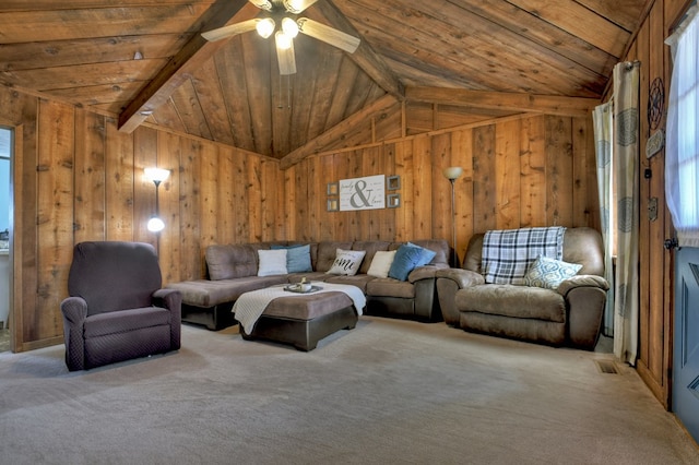 living room with ceiling fan, vaulted ceiling with beams, light carpet, wooden ceiling, and wood walls