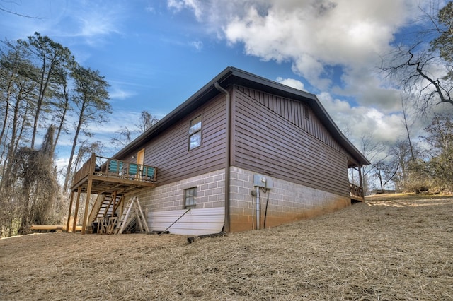 view of side of home featuring a deck