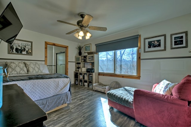 bedroom with ceiling fan and dark wood-type flooring