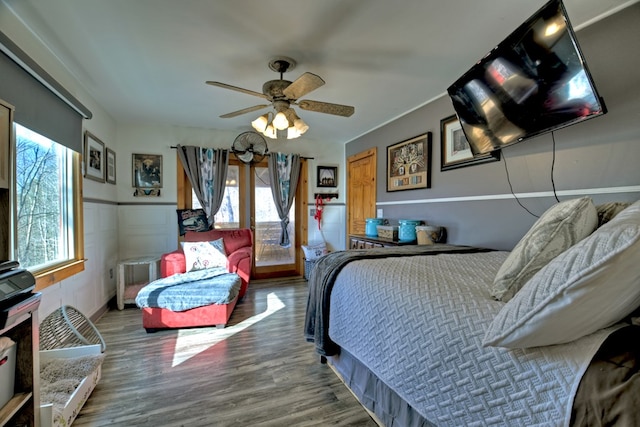 bedroom featuring hardwood / wood-style flooring and ceiling fan