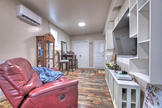 living room with dark hardwood / wood-style floors and an AC wall unit