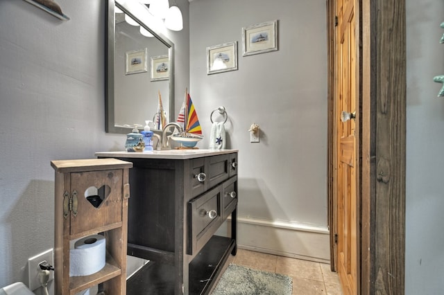 bathroom with tile patterned floors and vanity