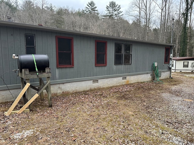 view of side of property featuring crawl space