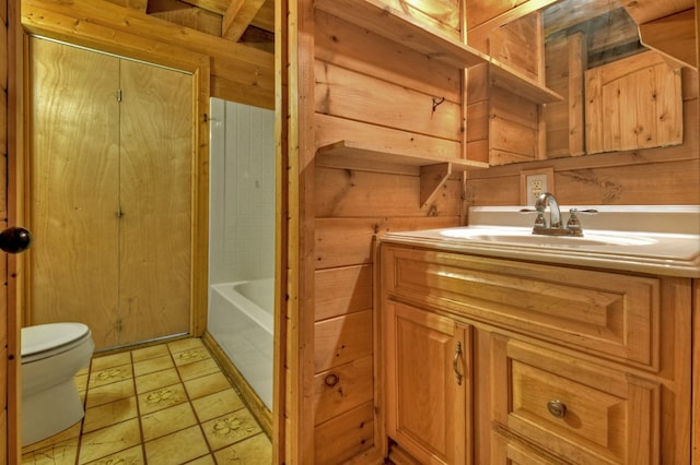 full bath featuring toilet, vanity, a tub, and a shower