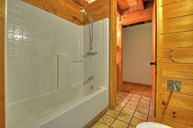 full bathroom featuring shower / tub combination, baseboards, and tile patterned floors
