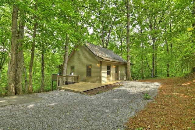 view of home's exterior featuring a wooden deck