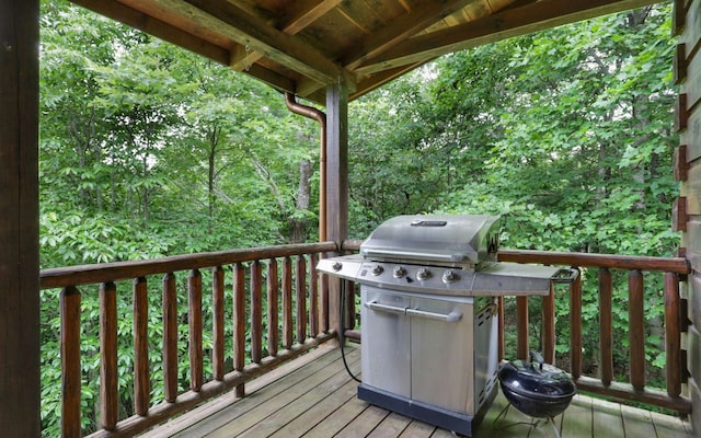 wooden terrace featuring grilling area