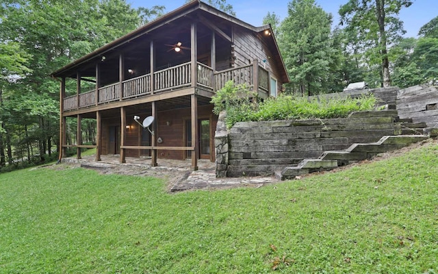 rear view of house with a lawn