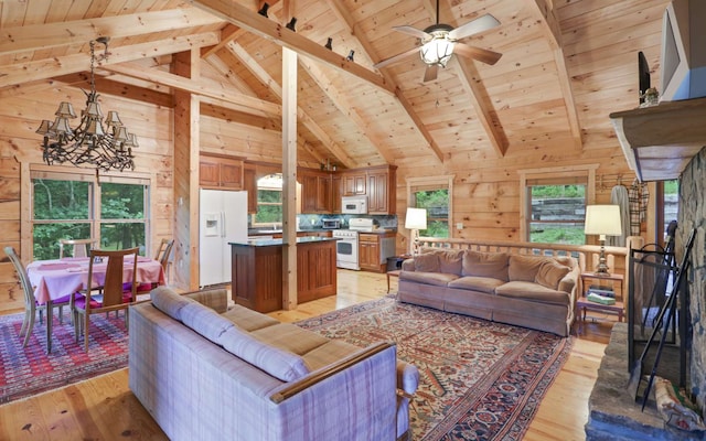 living room with high vaulted ceiling, beam ceiling, wooden ceiling, and light hardwood / wood-style floors