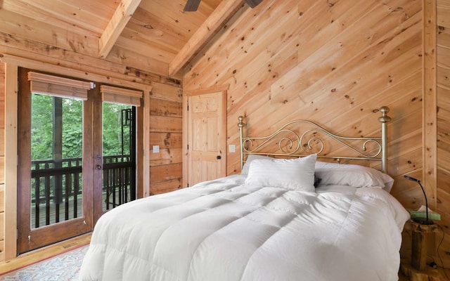 bedroom with wood walls, lofted ceiling with beams, wooden ceiling, access to exterior, and hardwood / wood-style floors