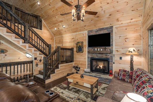 living room with hardwood / wood-style floors, ceiling fan, wooden ceiling, and wooden walls