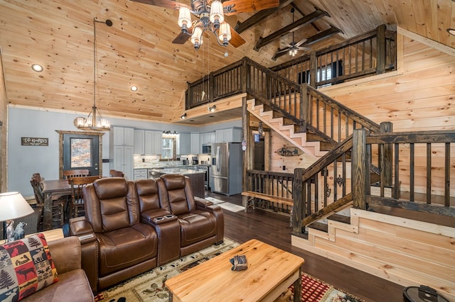 living room with wooden ceiling, high vaulted ceiling, beamed ceiling, hardwood / wood-style floors, and ceiling fan with notable chandelier