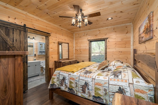 bedroom with ensuite bath, ceiling fan, wooden walls, wooden ceiling, and dark hardwood / wood-style floors