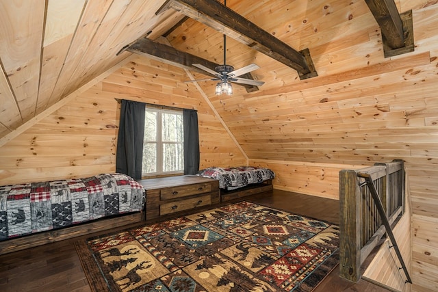 bedroom with wood-type flooring, vaulted ceiling with beams, ceiling fan, and wooden walls