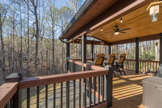 wooden deck with ceiling fan