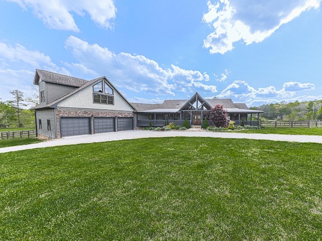 view of front facade featuring a garage and a front lawn