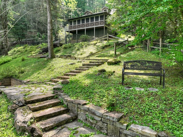 106 Butler Creek Rd, Cherry Log, GA 30522 - view of yard with stairway, a sunroom, and a view of trees