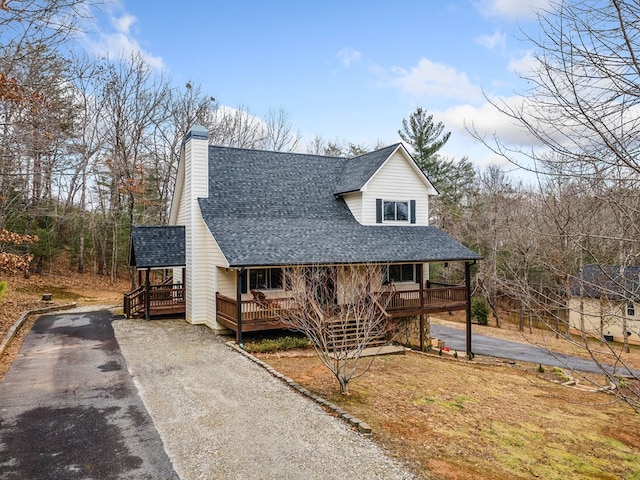 view of front facade with a wooden deck