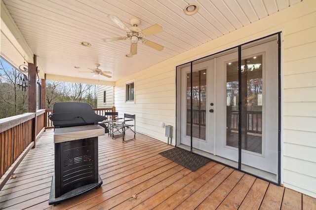 deck featuring grilling area and ceiling fan