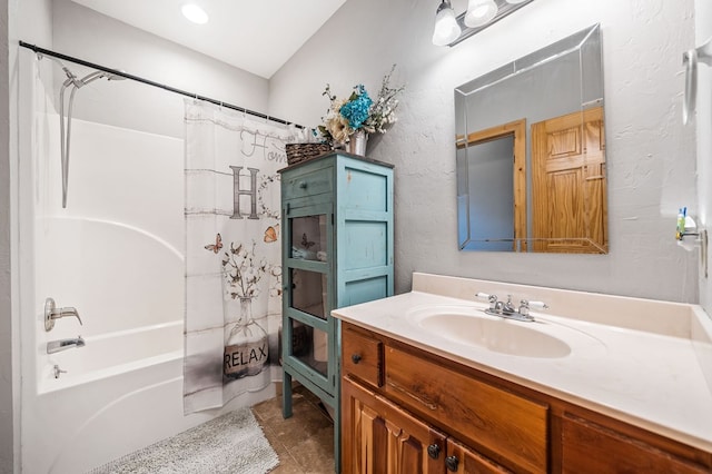 bathroom with shower / tub combo with curtain and vanity