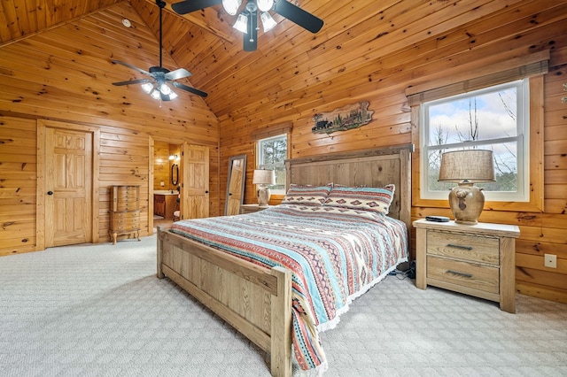 bedroom with high vaulted ceiling, light carpet, wooden ceiling, and wooden walls