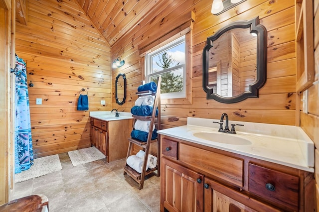 bathroom featuring vanity, wooden walls, wooden ceiling, and vaulted ceiling