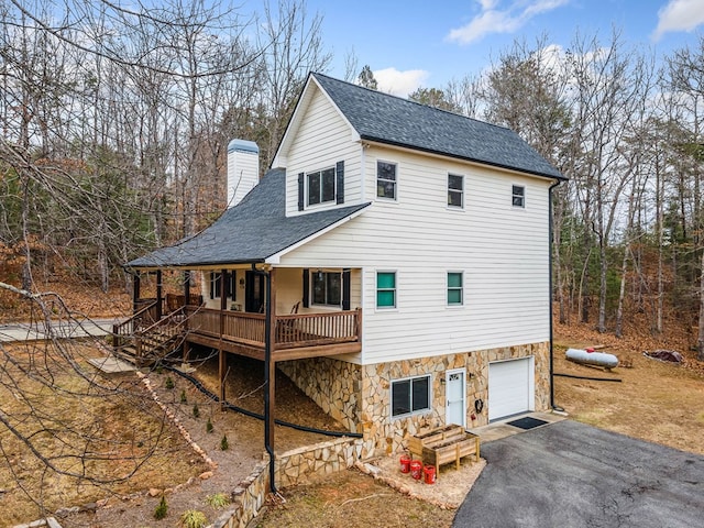 exterior space with a garage and a porch