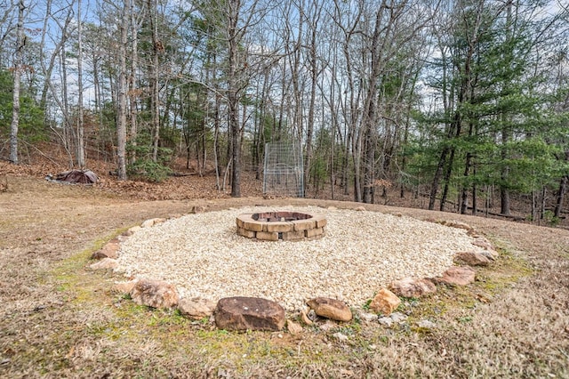 view of yard with an outdoor fire pit