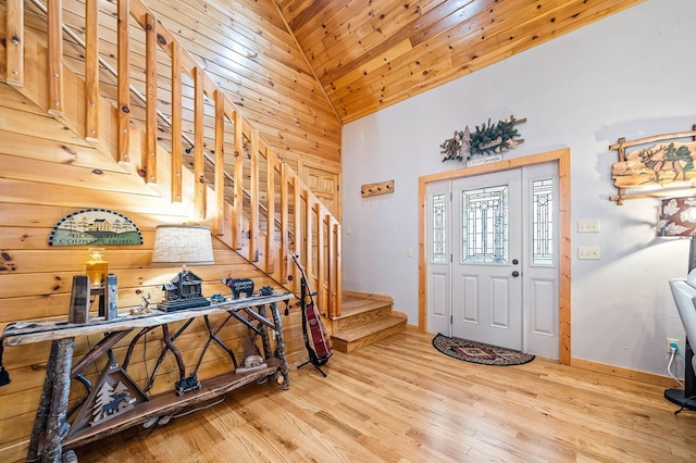 entrance foyer featuring wood ceiling, high vaulted ceiling, and light wood-type flooring