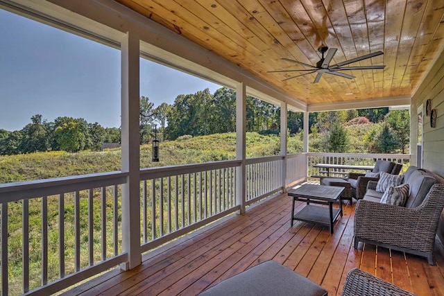 deck with an outdoor hangout area and ceiling fan