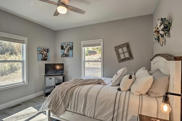 bedroom featuring ceiling fan and light wood-type flooring