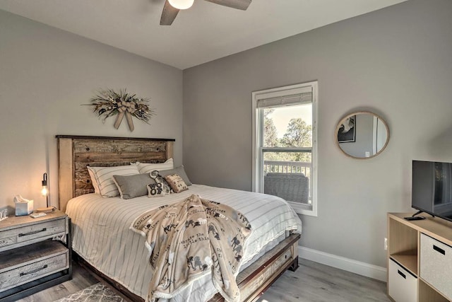 bedroom with ceiling fan and light hardwood / wood-style flooring