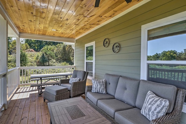 wooden terrace featuring outdoor lounge area