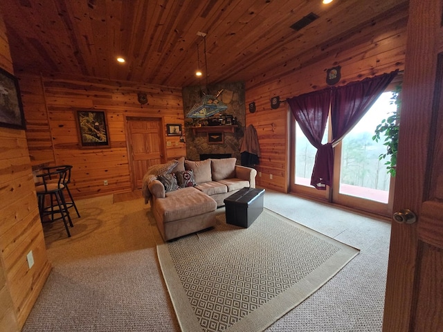 living room with carpet floors, wood ceiling, and wood walls