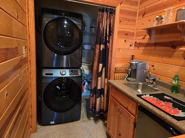 laundry area with stacked washer / drying machine, wooden walls, and wet bar