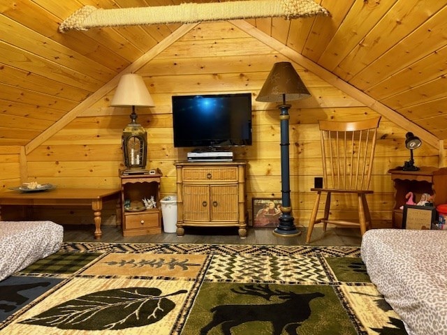 bedroom featuring wooden walls, wood ceiling, and vaulted ceiling