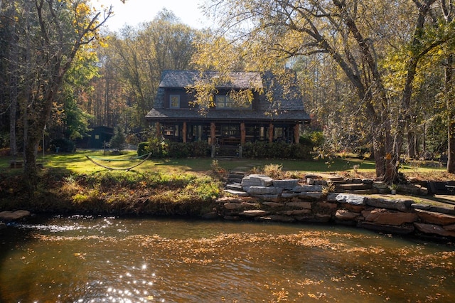 exterior space with a water view